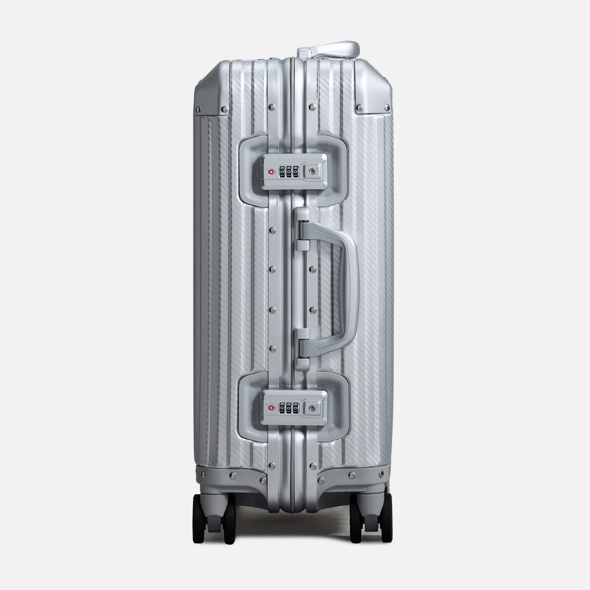 Nordcase Trava sølv aluminium kuffert sidevisning med hjul og håndtag