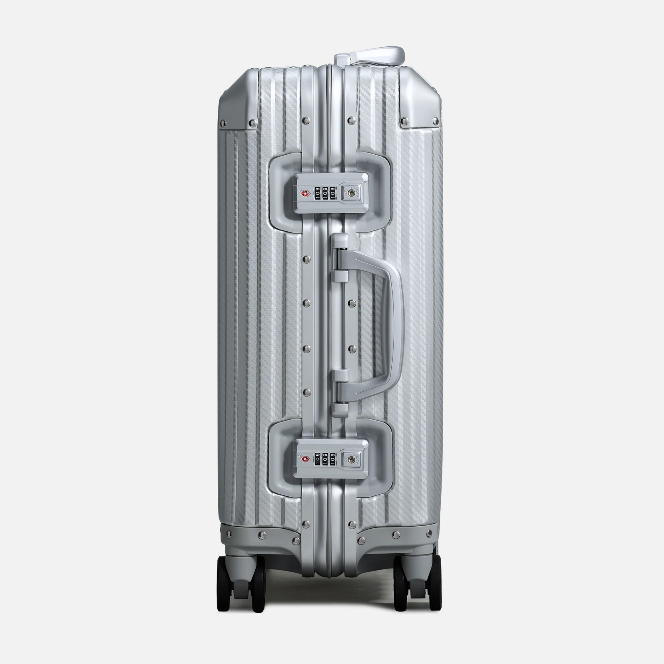 Nordcase Trava sølv aluminium kuffert sidevisning med hjul og håndtag